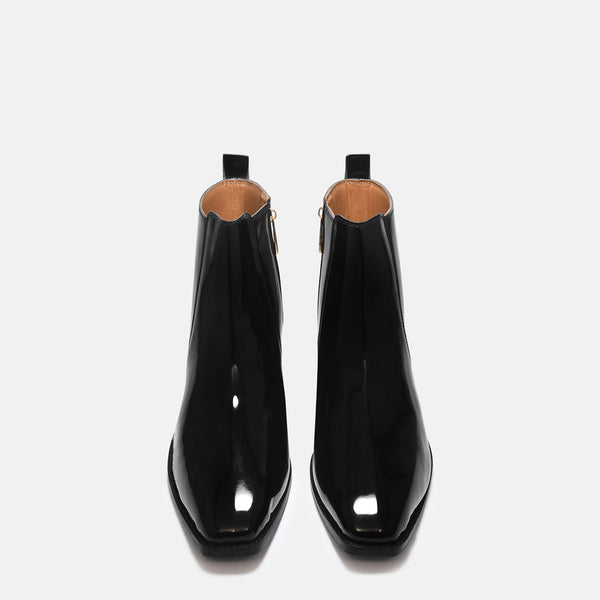 A man's patent leather boot in black or a Cuban heel