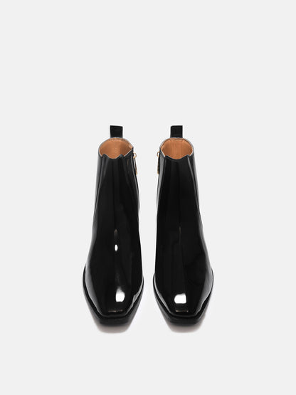 A man's patent leather boot in black or a Cuban heel