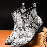A pair of black and white snake printed leather boot with square toe and a black colour Cuban heel