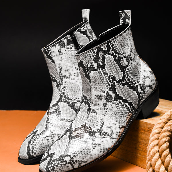 A pair of black and white snake printed leather boot with square toe and a black colour Cuban heel