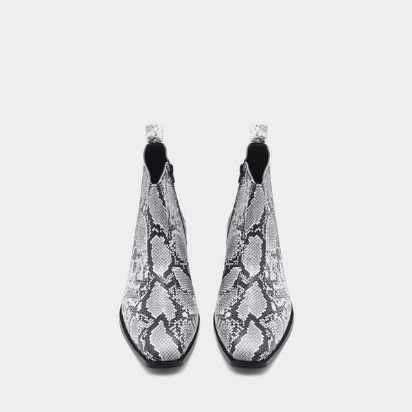 A pair of black and white snake printed leather boot with square toe and a black colour Cuban heel