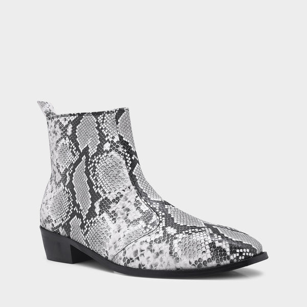 A pair of black and white snake printed leather boot with square toe and a black colour Cuban heel