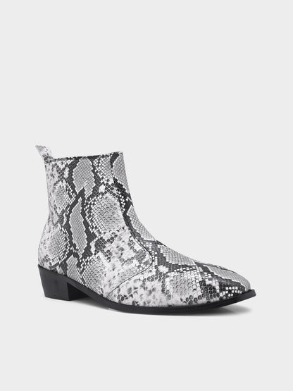 A pair of black and white snake printed leather boot with square toe and a black colour Cuban heel