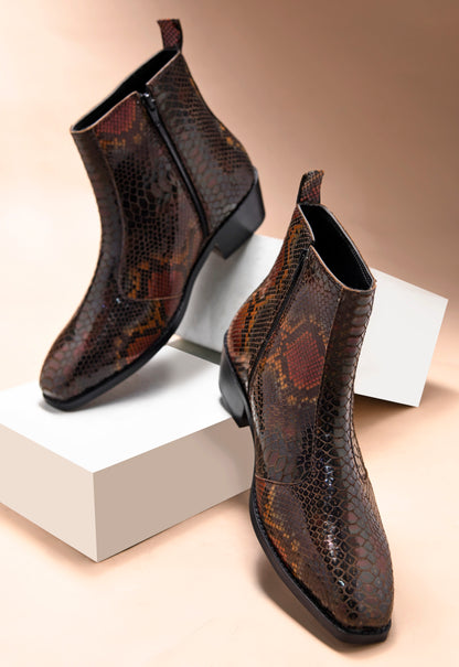 A men's leather boot with a snake-textured boot, featuring a Cuban heel and a side zipper.
