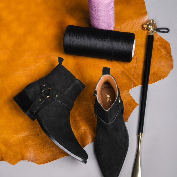 Phantom black suede harness boots for men featuring a pointed toe, side zip closure, and attached leather thong strap – luxury ankle boots by RNK Luxe for bold, stylish looks.