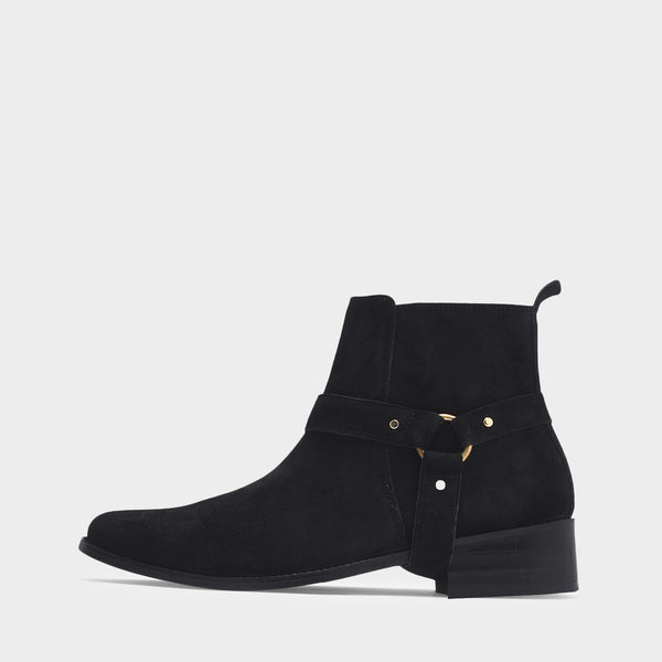 Phantom black suede harness boots for men featuring a pointed toe, side zip closure, and attached leather thong strap – luxury ankle boots by RNK Luxe for bold, stylish looks.