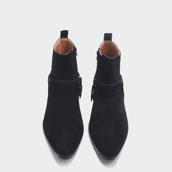 Phantom black suede harness boots for men featuring a pointed toe, side zip closure, and attached leather thong strap – luxury ankle boots by RNK Luxe for bold, stylish looks.