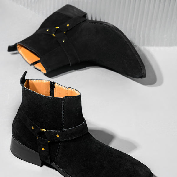 Phantom black suede harness boots for men featuring a pointed toe, side zip closure, and attached leather thong strap – luxury ankle boots by RNK Luxe for bold, stylish looks.