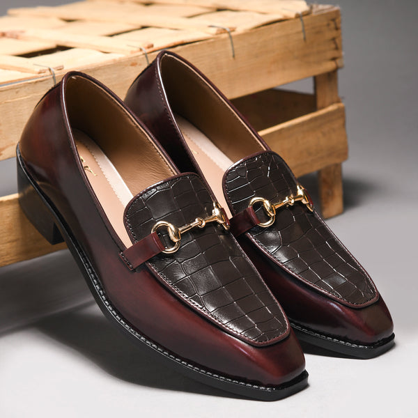 A pair of cherry leather loafer in which it embossed with brown croco leather on top with a golder horesit buckle