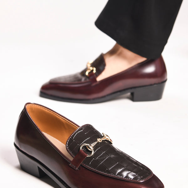 A pair of cherry leather loafer in which it embossed with brown croco leather on top with a golder horesit buckle