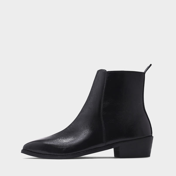 Black patent leather boots with side zipper on a Cuban heel