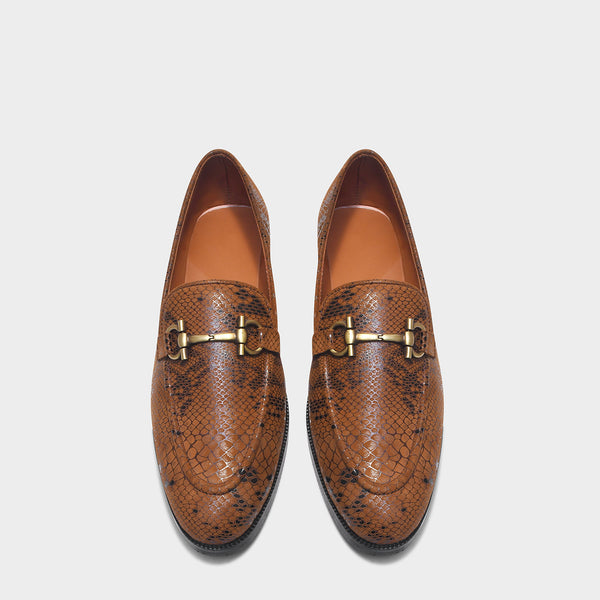 Brown snake-patterned penny loafer shoe on mid heel with a horsebit buckle